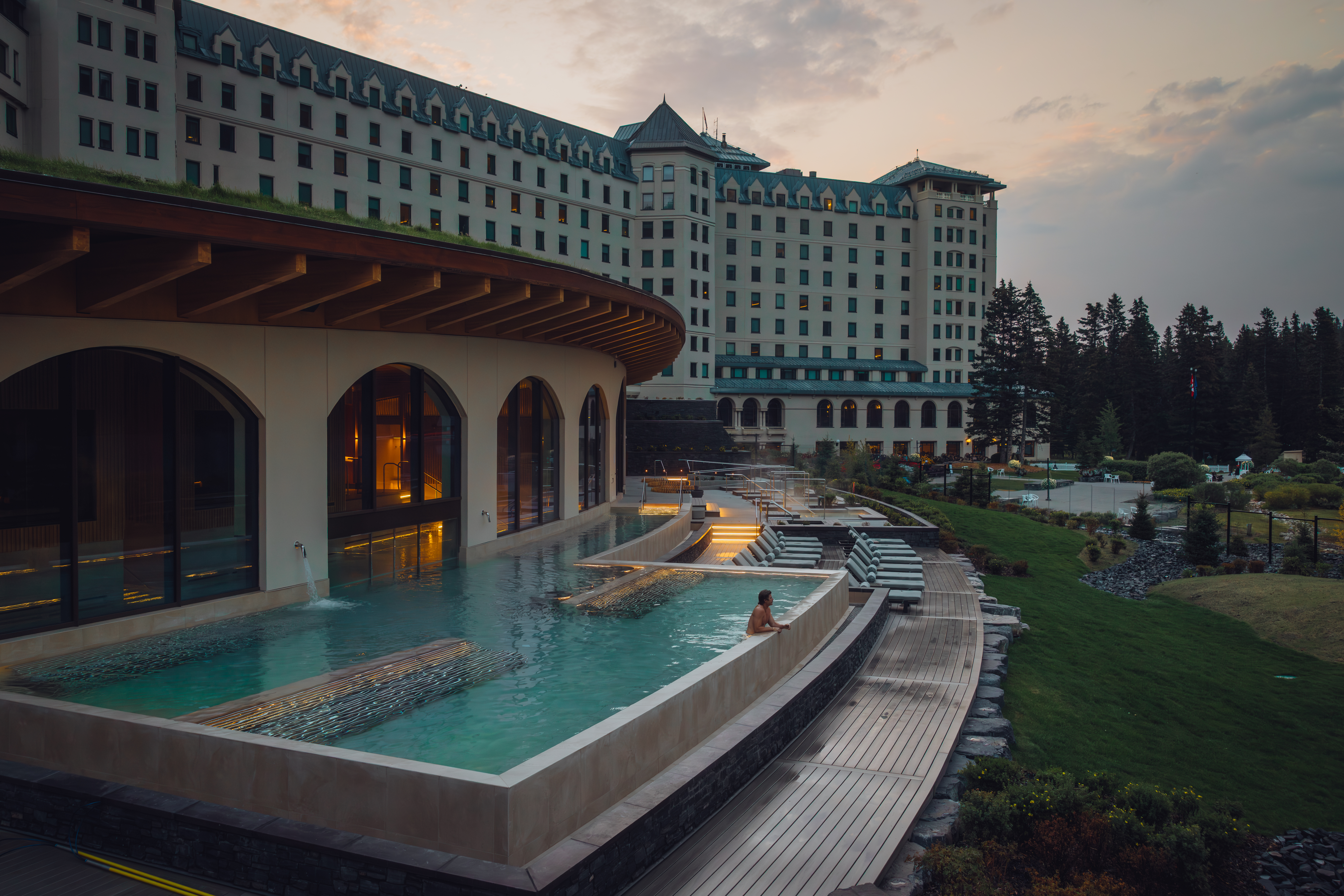 Person sitting in the outdoor pool at Fairmont Chateau Lake Louise