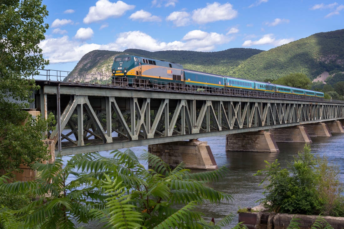 VIA Rail's Corridor train passing over a river bridge on the way to Quebec City. 