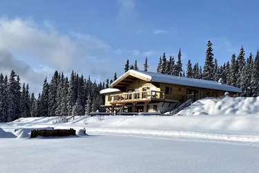 Log restaurant building daytime in winter, Southern Lakes Resort