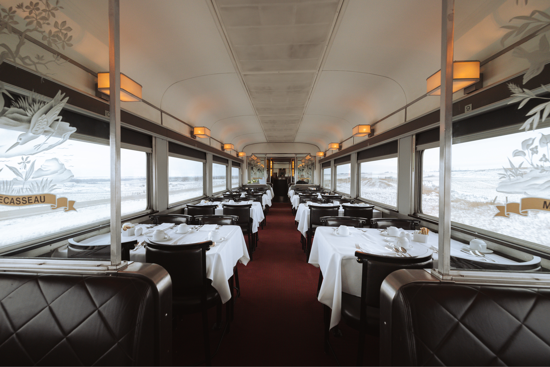 Tables set up in the classic dning car on VIA Rail Canada sleeper train 
