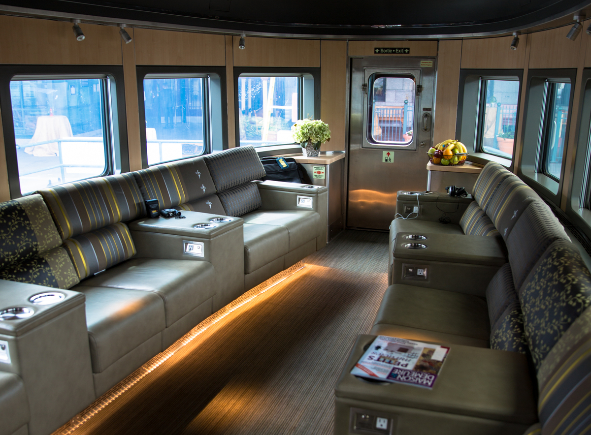 A rear-facing lounge car in the Prestige Park car on the VIA Rail The Canadian train