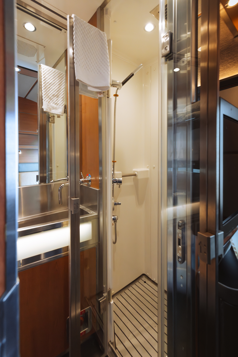 Private washroom with fixtures and shower in Prestige Sleeper cabin onboard VIA Rail's train, the Canadian