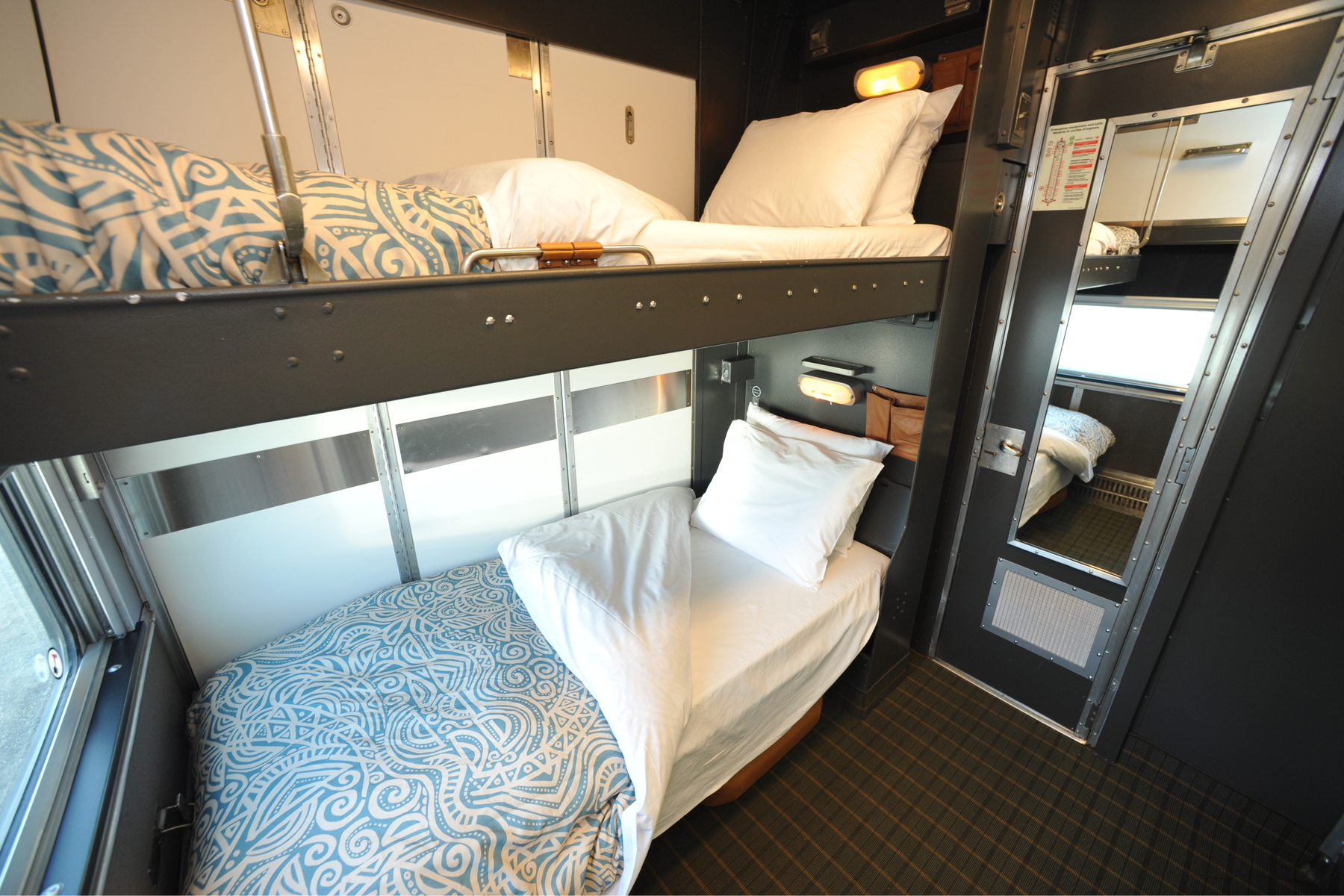 Bunk beds in a sleeper cabin for two in VIA Rail on a Western train tour 