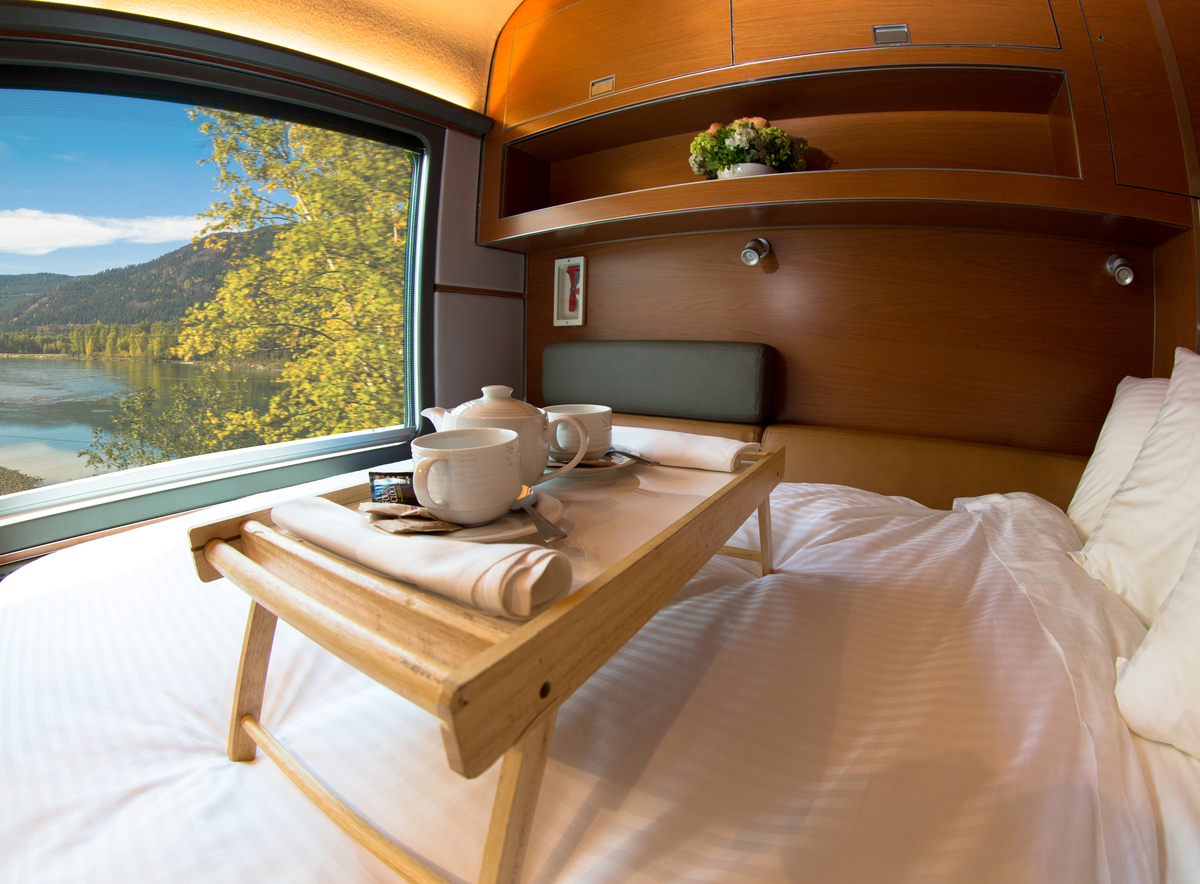 Plush bed facing train window in VIA Rail Prestige cabin for two