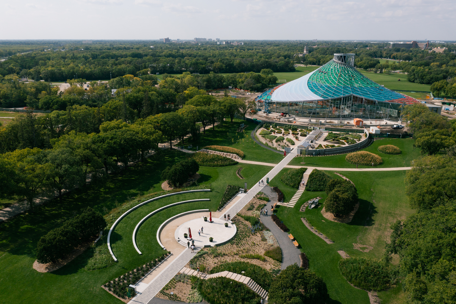 Aerial shot of a modern building and surrounding gardens