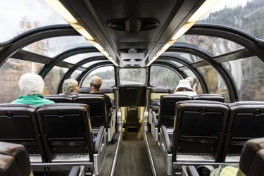 Passengers seated inside one of VIA Rail's dome cars