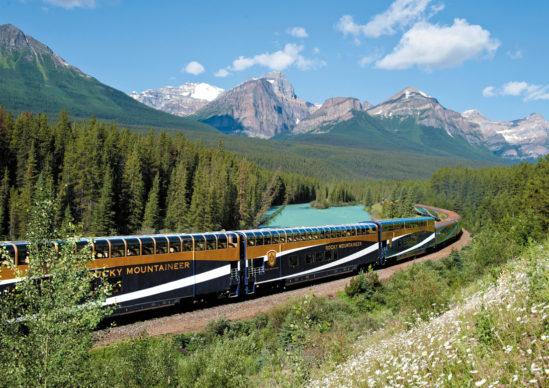 Rocky Mountaineer train coach rounds Morant's Curve in Banff National Park