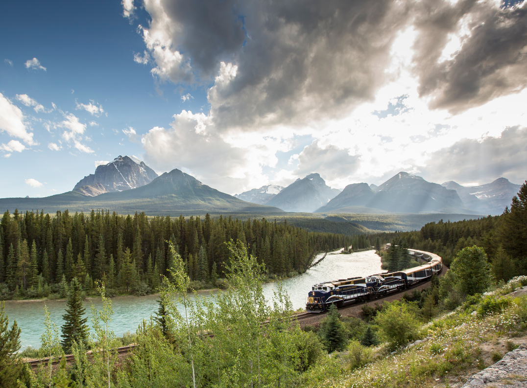 Rocky Mountaineer train going around Morant's Curve in the Canadian Rockies