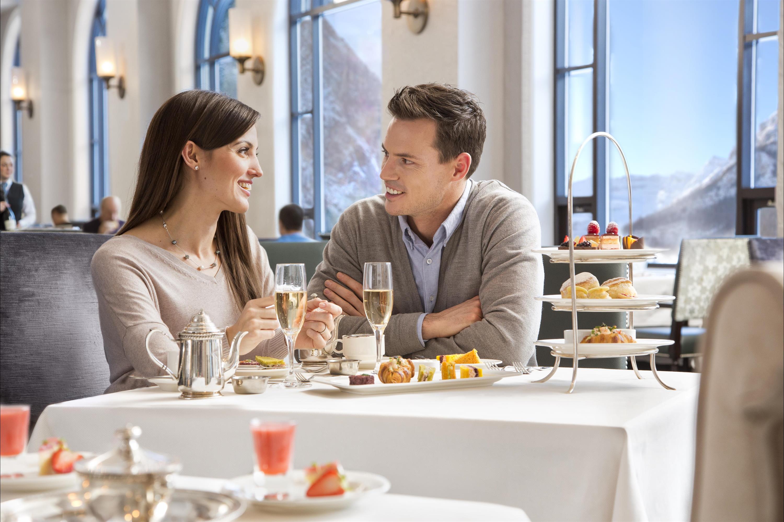 Couple having tea at the Fairmont Chateau Lake Louise