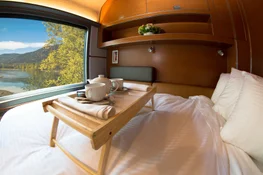 Plush bed facing train window in VIA Rail Prestige cabin for two