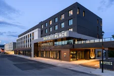 Exterior view of the modern Hyatt Place Hotel in Whitehorse during early evening