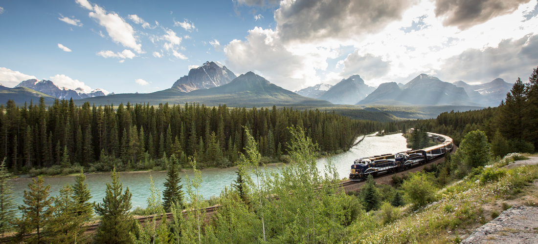 Rocky Mountaineer train going around Morant's Curve in the Canadian Rockies
