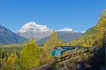 VIA Rail train passing Mt. Robson in the Canadian Rockies