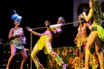 A man limbos under a pole at the Caribbean Pavilion at Winnipeg's Folklorama
