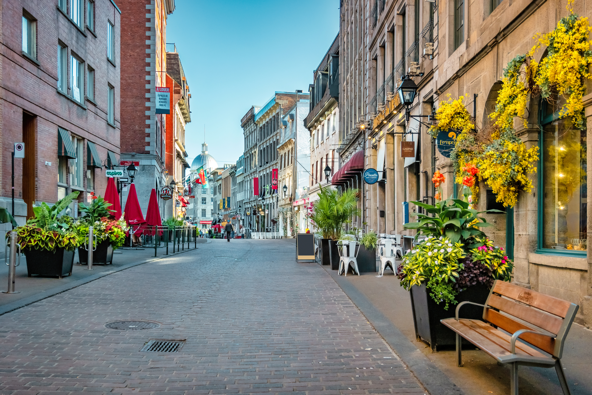 Cobbled street with businesses in Old Town Montreal, Quebec, Canada.