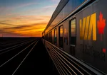 side view of a VIA Rail train at sunset