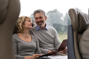 Couple sitting in SilverLeaf seats on the Rocky Mountaineer train
