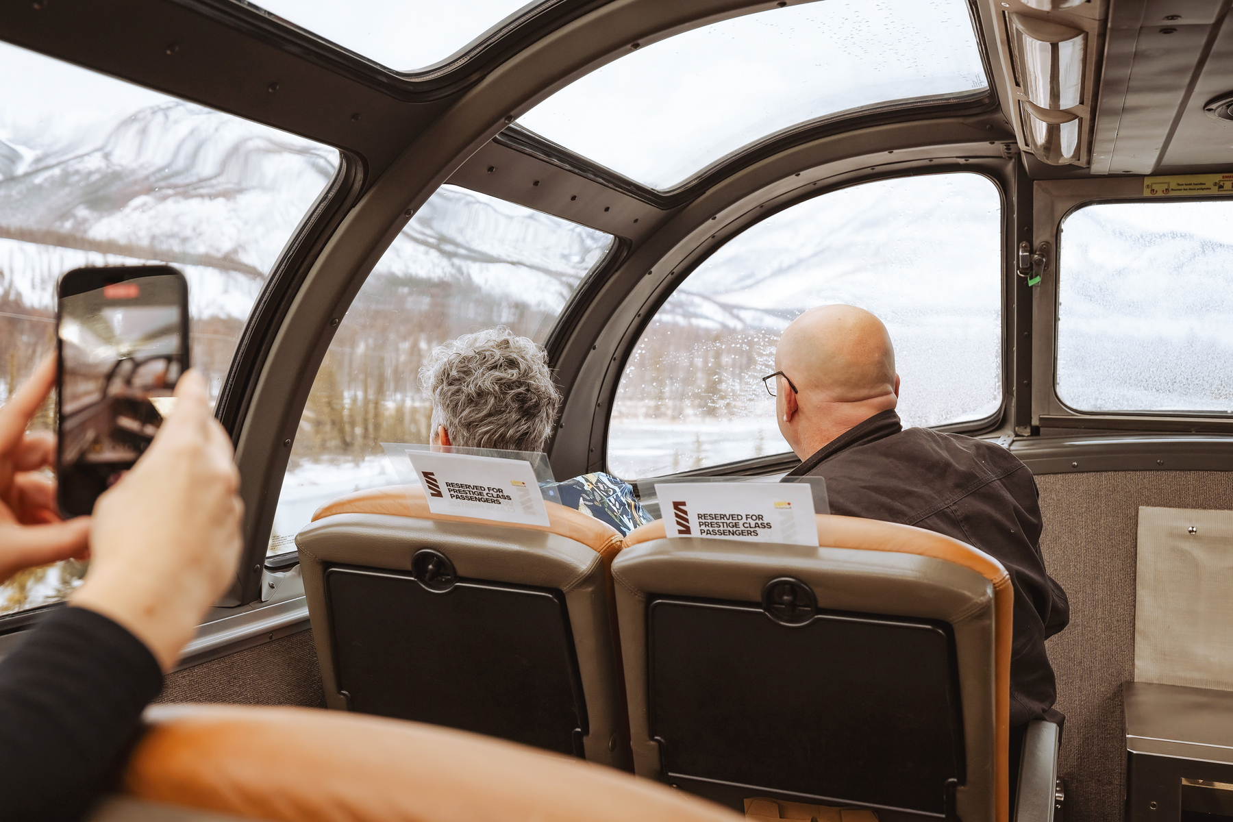 Passengers in the domed viewing area of the VIA Rail Vancouver to Jasper train