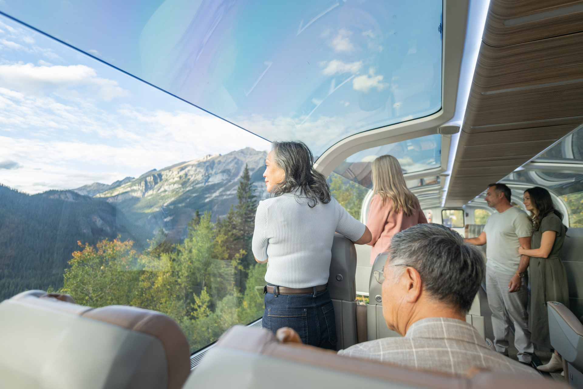 Guests looking at scenery from their seats in the GoldLeaf dome car