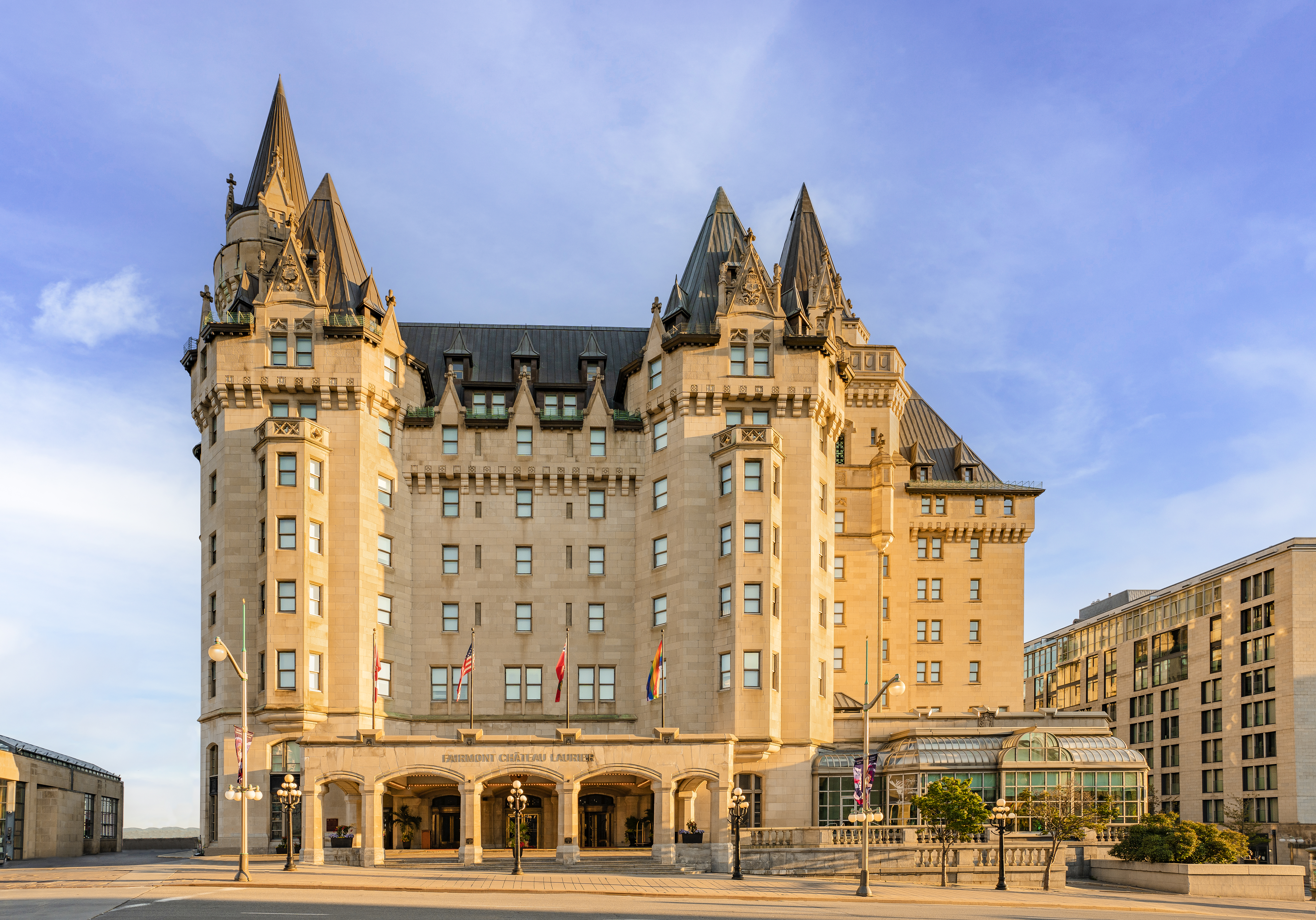 Exterior view of castle-like Fairmont Chateau Laurier with blue sky above
