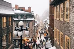 Shoppers line the streets of Petit Champlain, a popular shopping district in Quebec City.