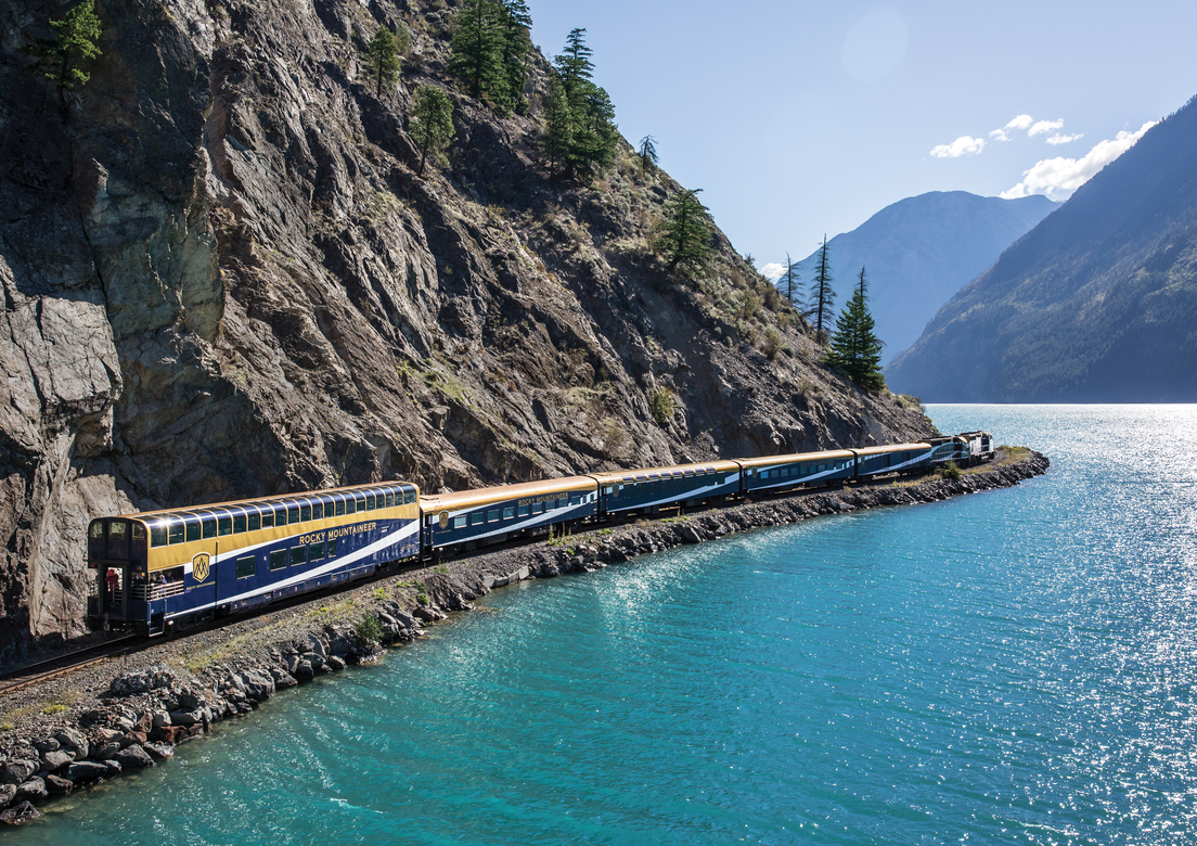 Rocky Mountaineer travels by glistening fjord