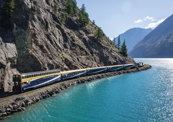 Rocky Mountaineer travels by glistening fjord