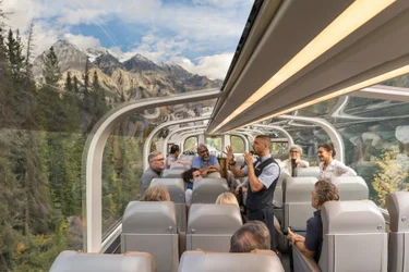 Onboard Host speaks about the scenery from GoldLeaf dome on the Rocky Mountaineer Train