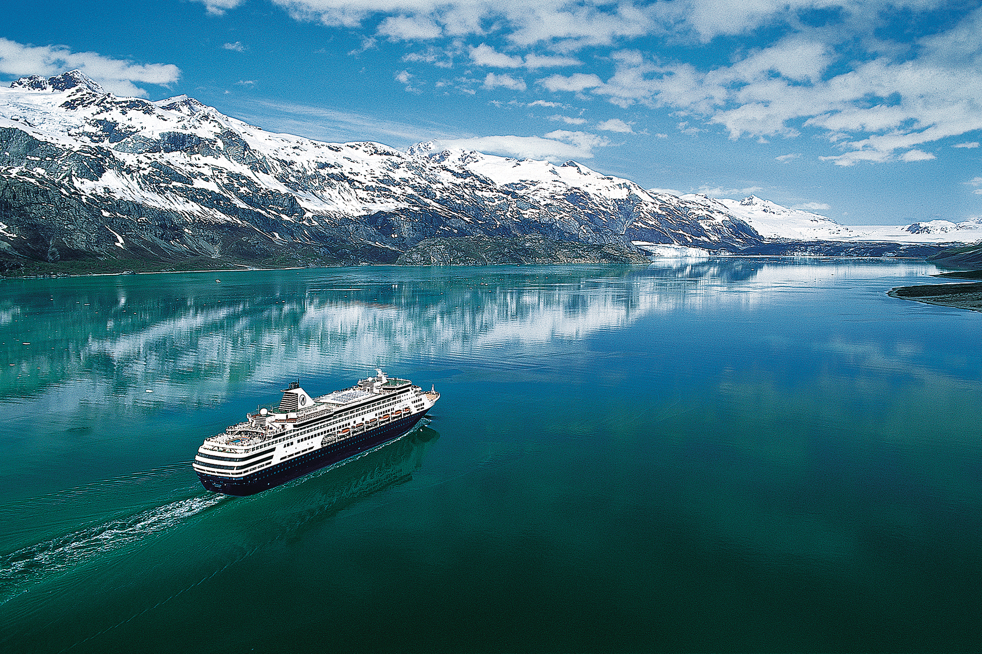 Holland America ship sailing past glaciers in Alaska