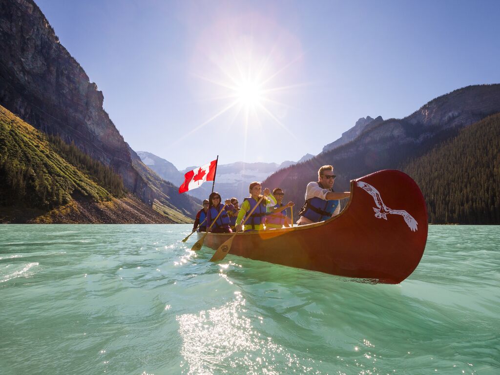 Group of adults paddling in Lake Louise