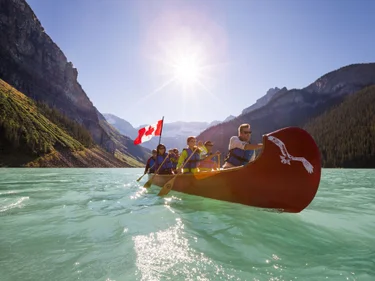 Group of adults paddling in Lake Louise