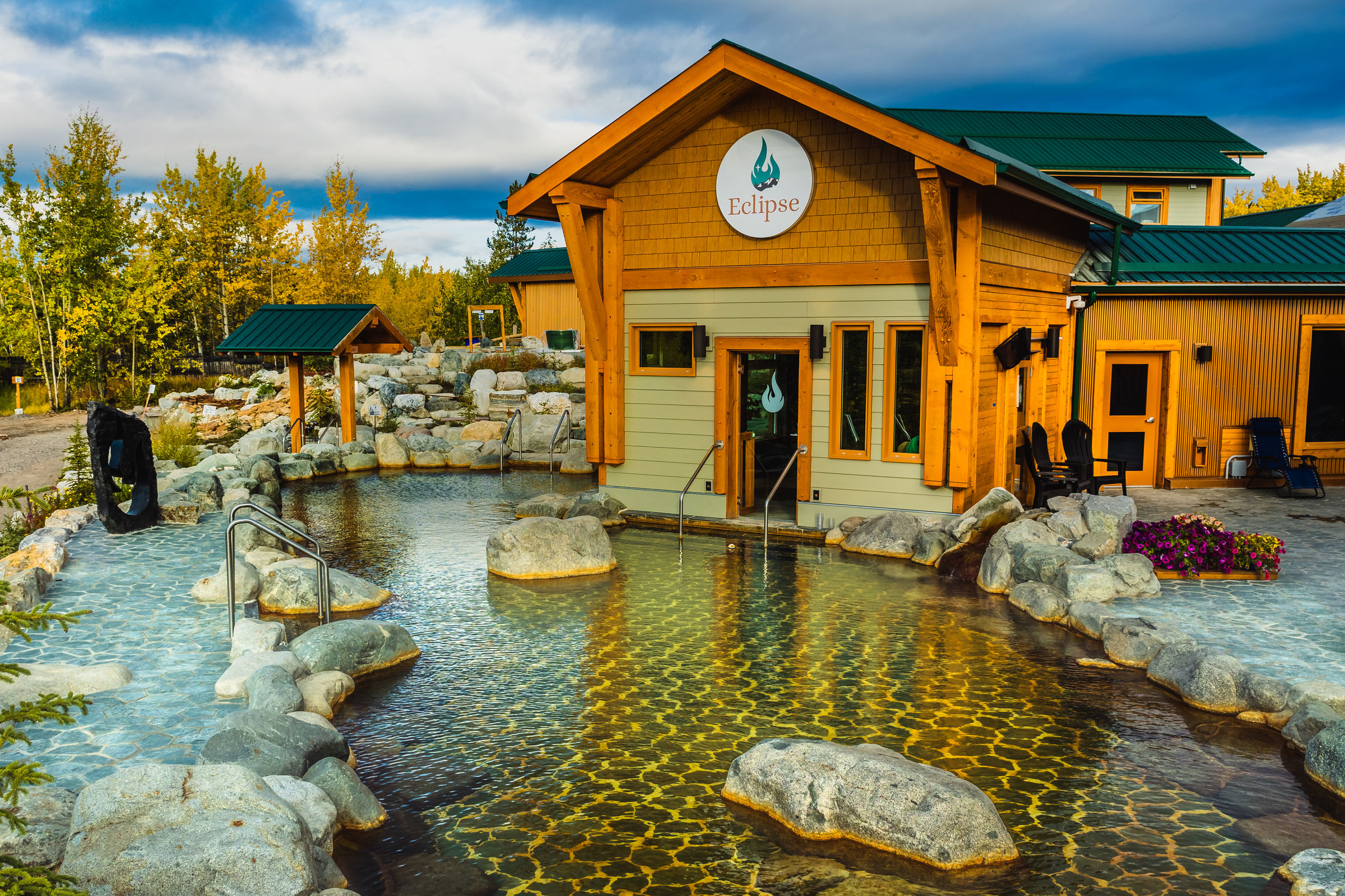 Hot pools at the Eclipse Nordic hot springs and trees with fall colours