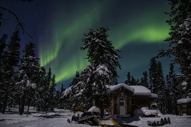 The Northern Lights over Gangler's Subarctic Lodge in winter.