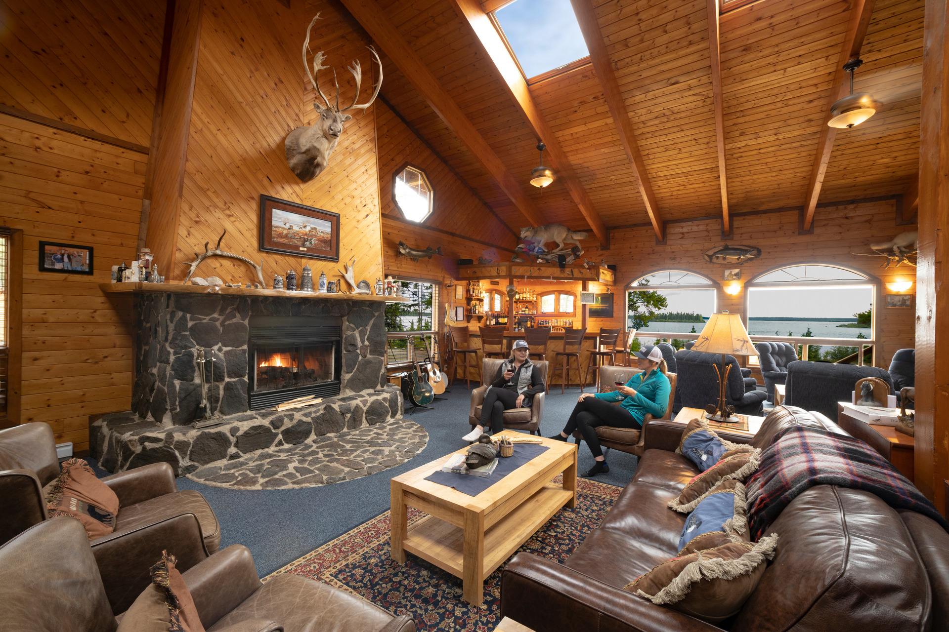 Main Lodge filled with furniture and a fireplace