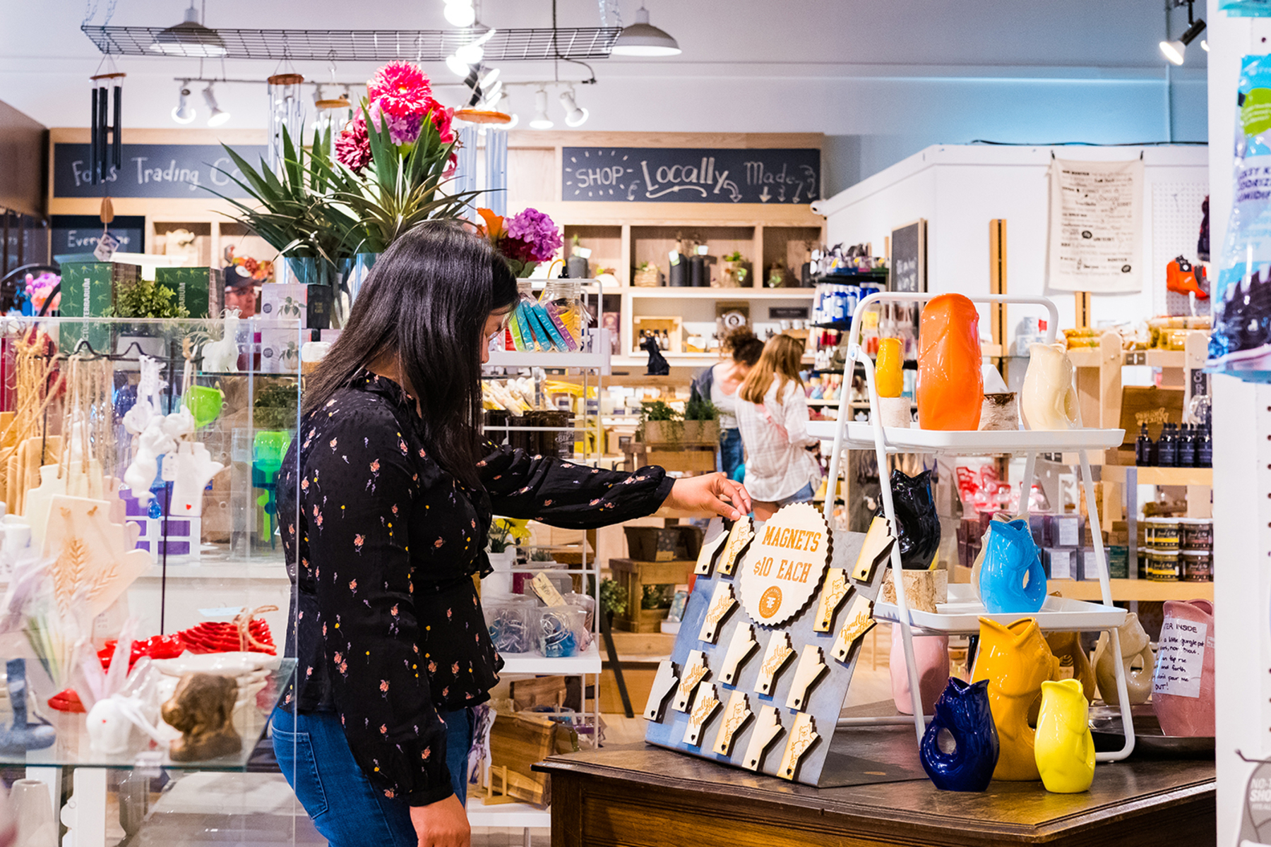A woman looks at local products in a gift store at The Forks