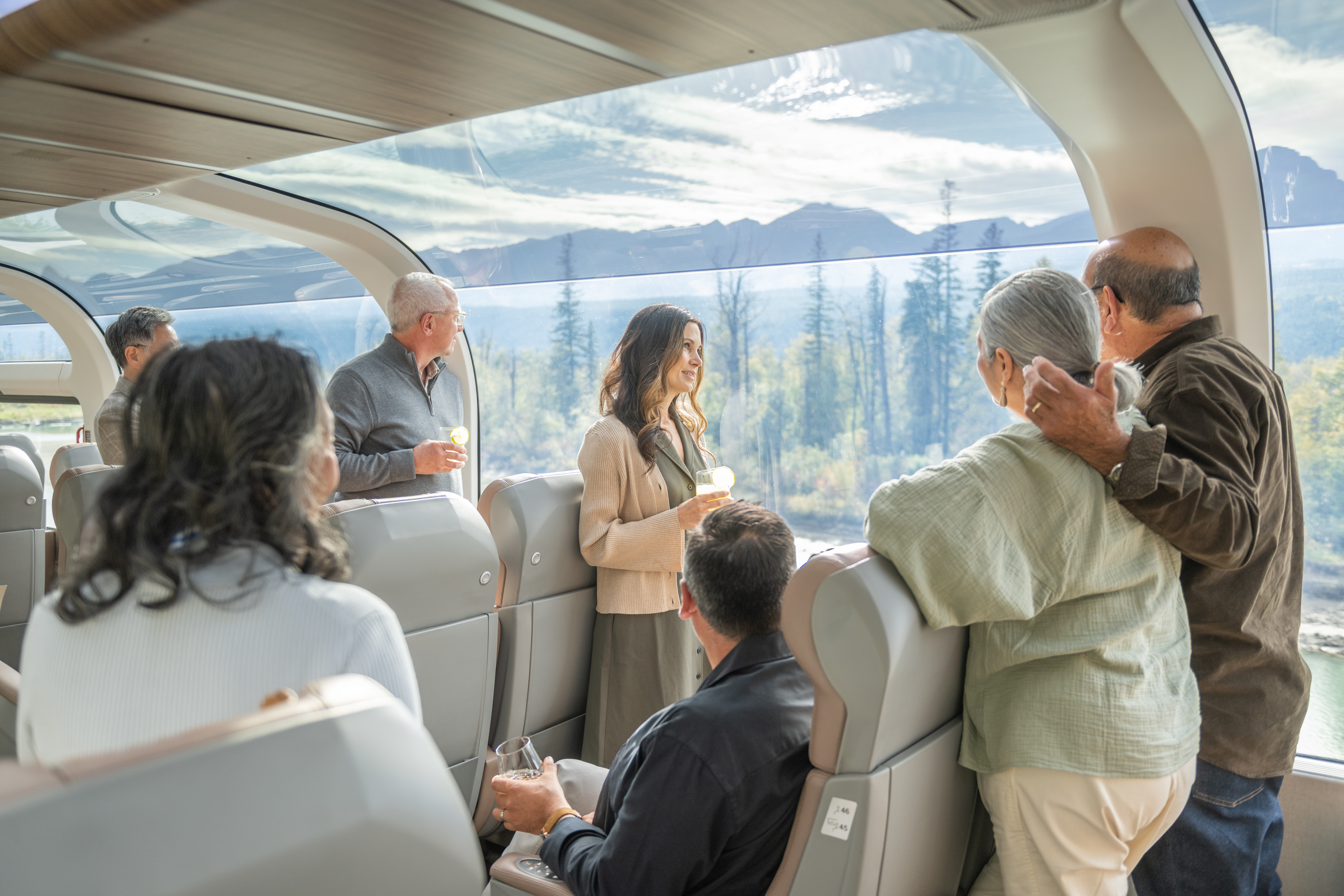 Guests socializing at their seats in GoldLeaf on the Rocky Mountaineer Train