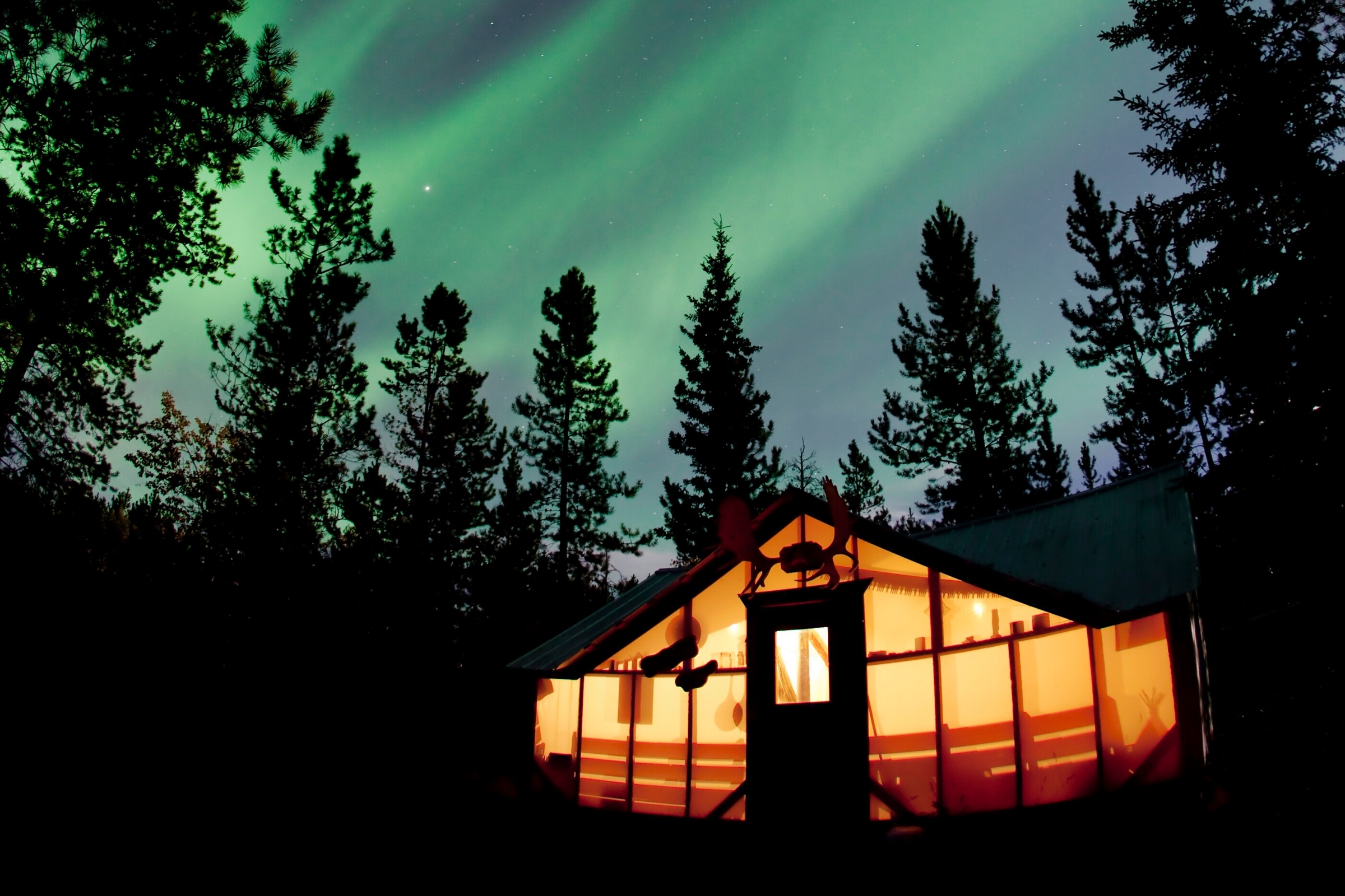 Northern lights over a cabin