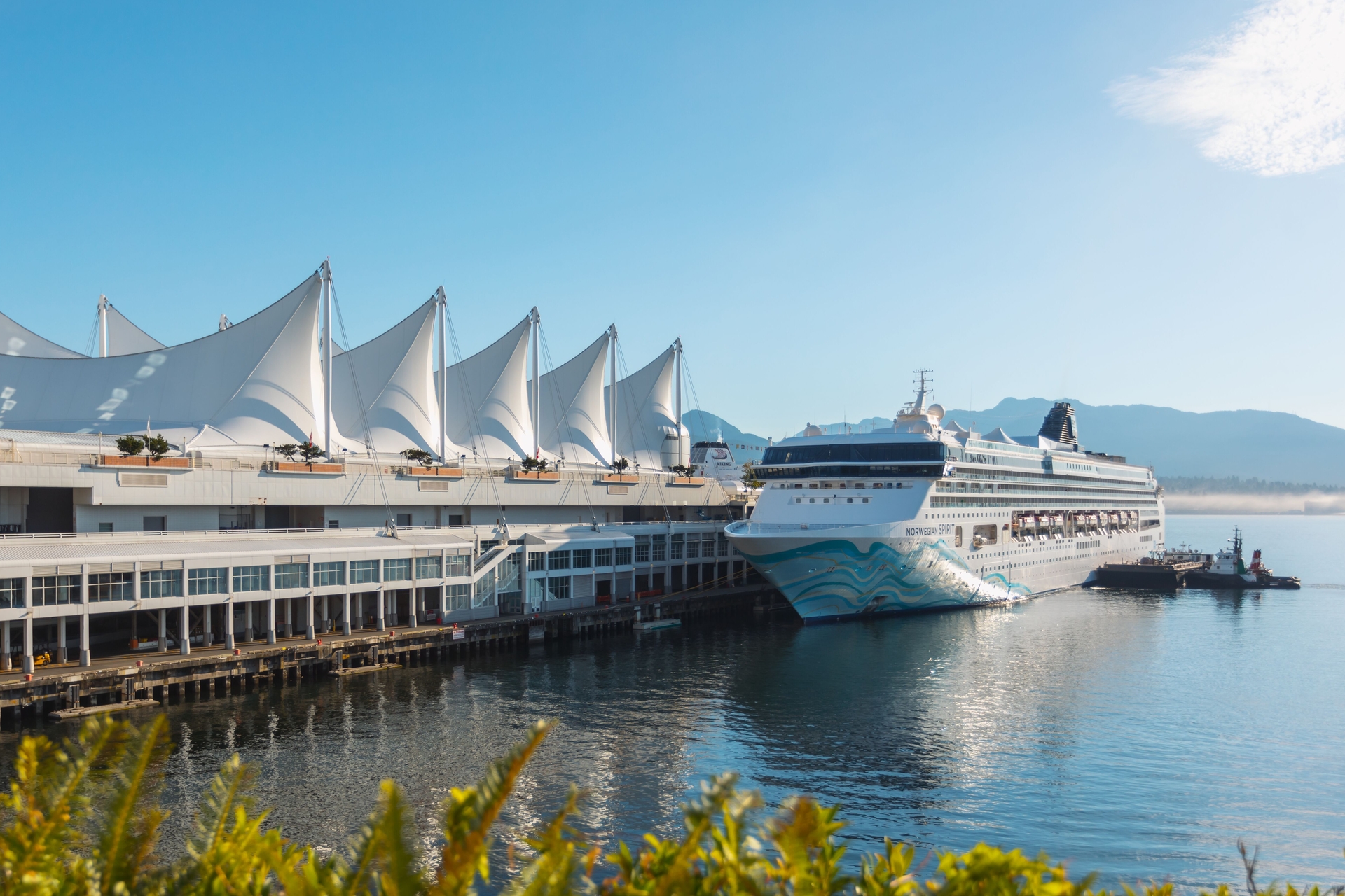 A cruise boat is docking at Vancouver Harbour