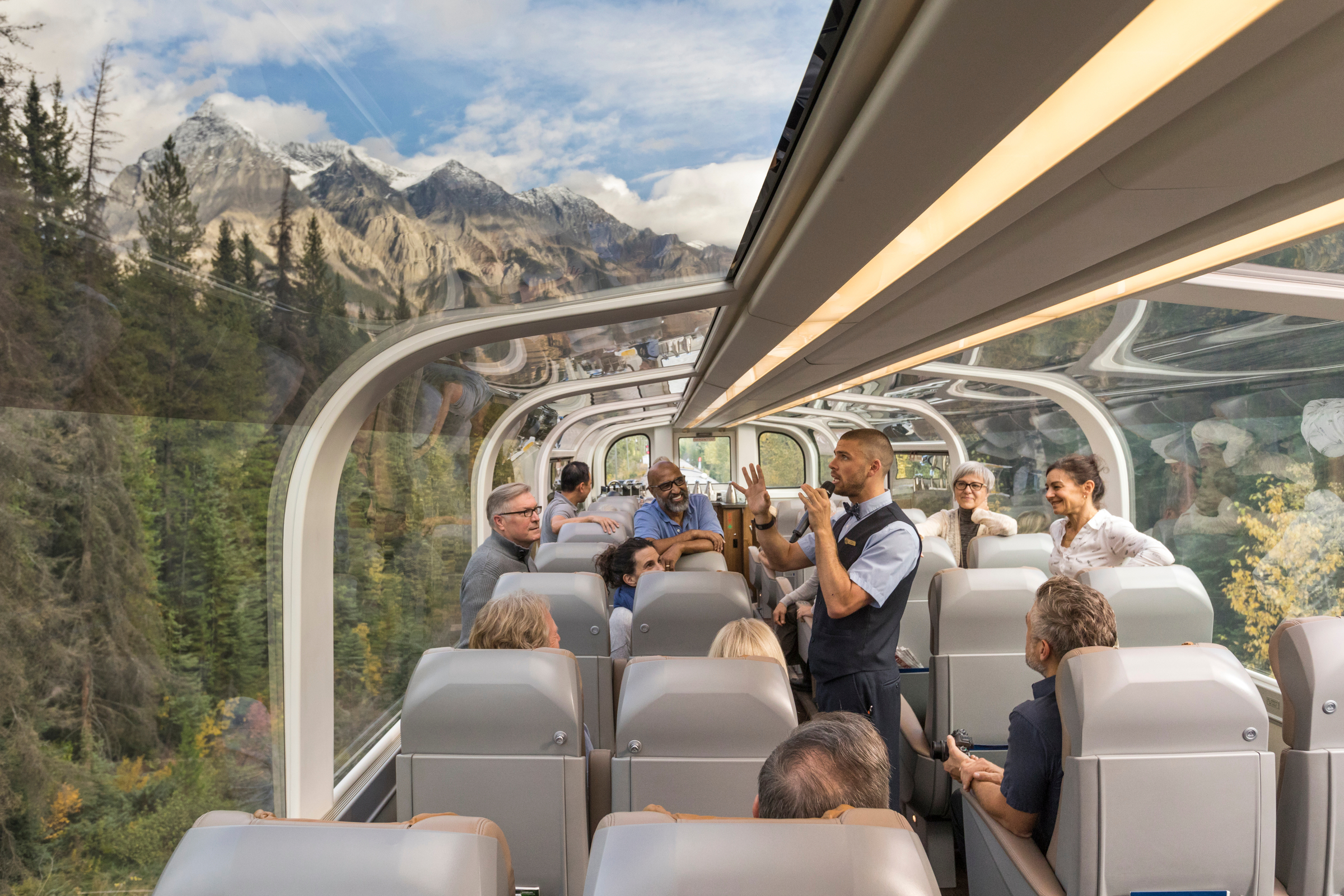 Onboard Host speaks about the scenery from GoldLeaf dome on the Rocky Mountaineer Train