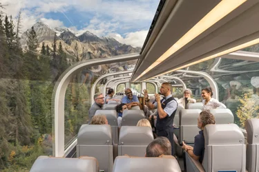 Onboard Host speaks about the scenery from GoldLeaf dome on the Rocky Mountaineer Train