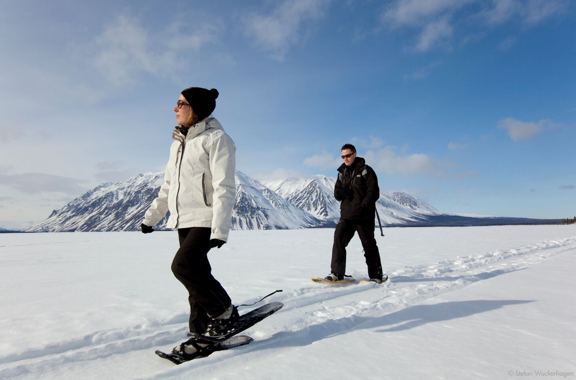 young couple snowshoeing in Whitehorse Yukon