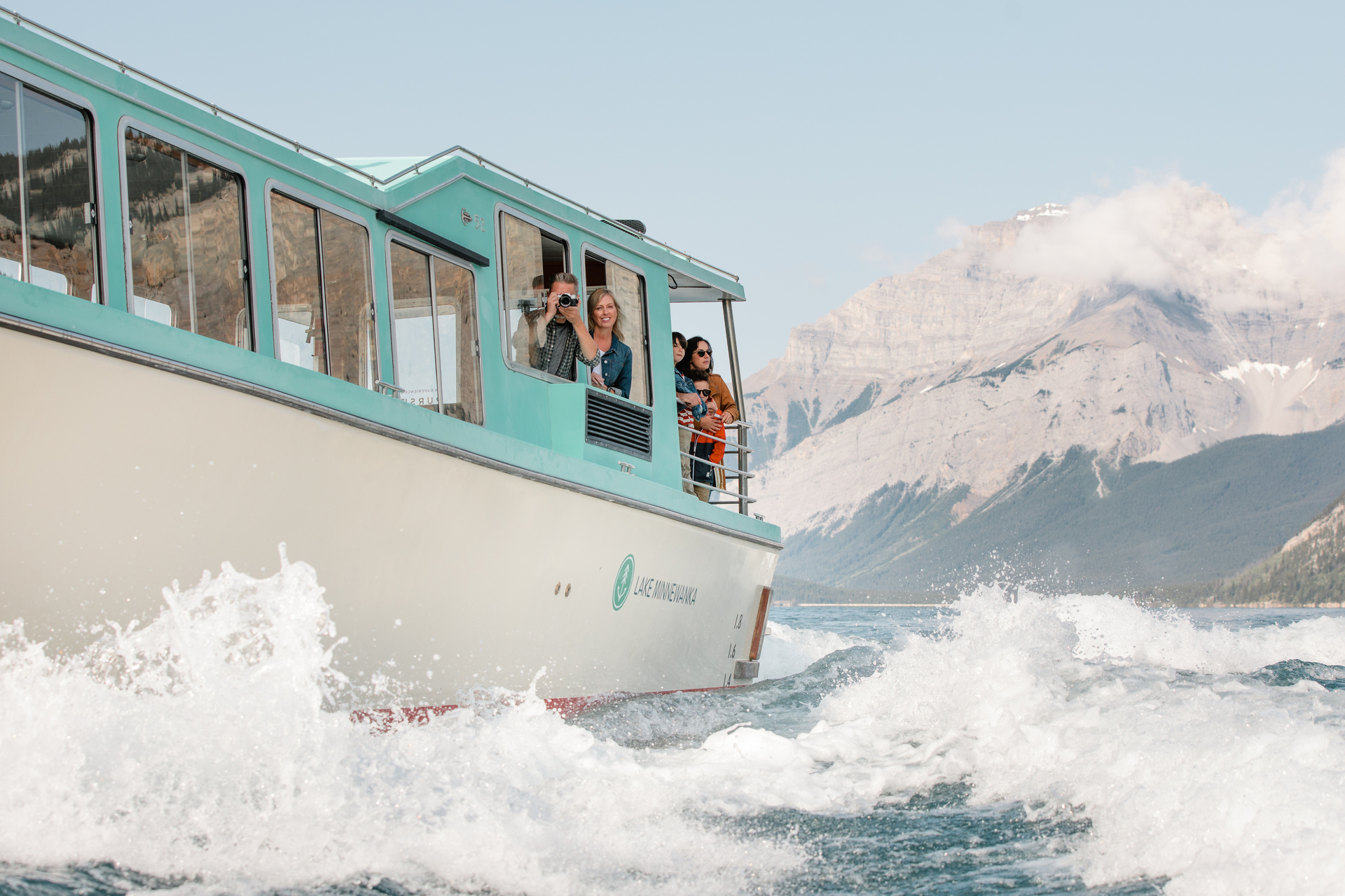 Waves crash against the cruise boat on Lake Minnewanka.