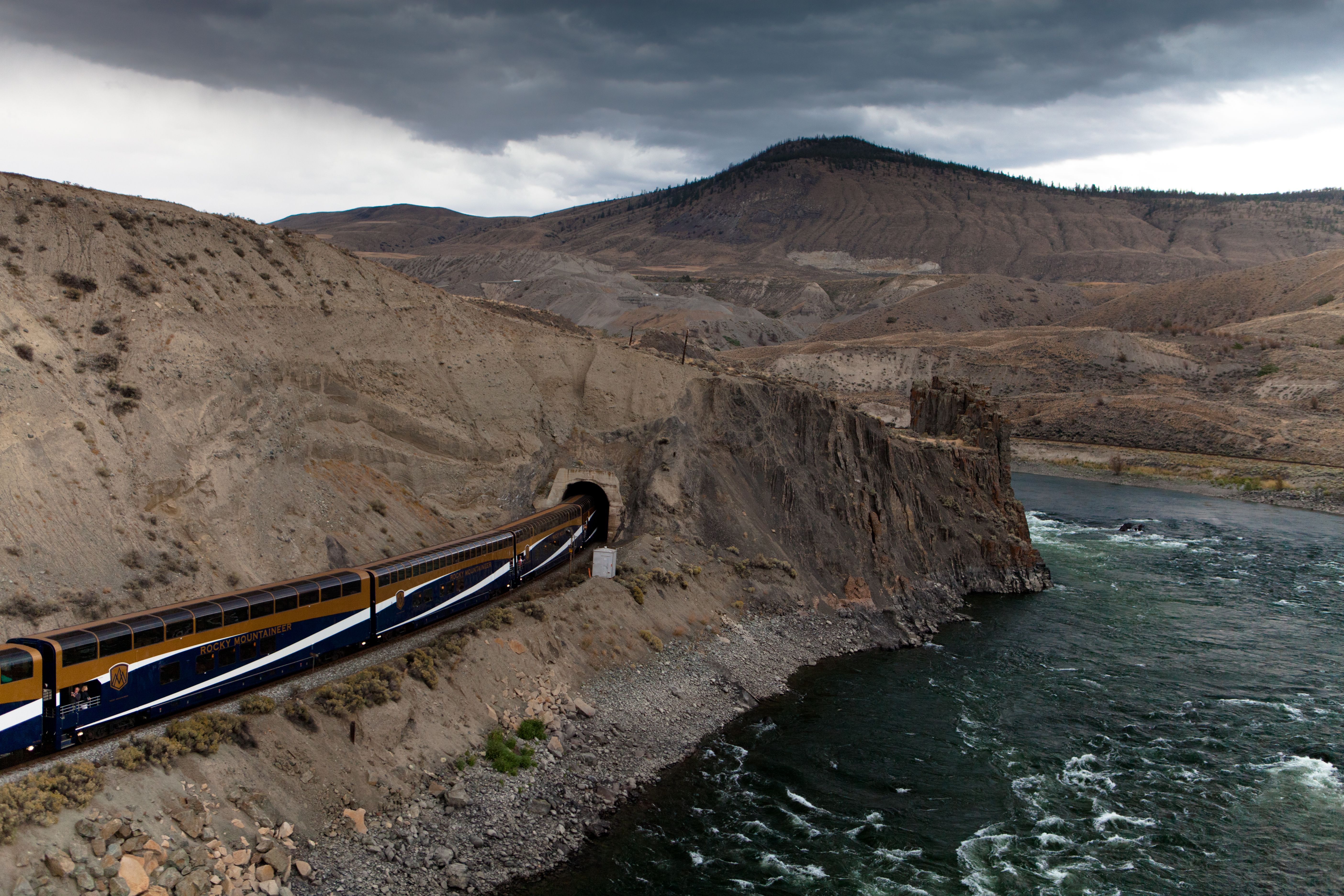 A Rocky Mountaineer train entering a tunnel at Black Canyon near Ashcroft, BC
