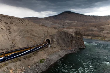A Rocky Mountaineer train entering a tunnel at Black Canyon near Ashcroft, BC