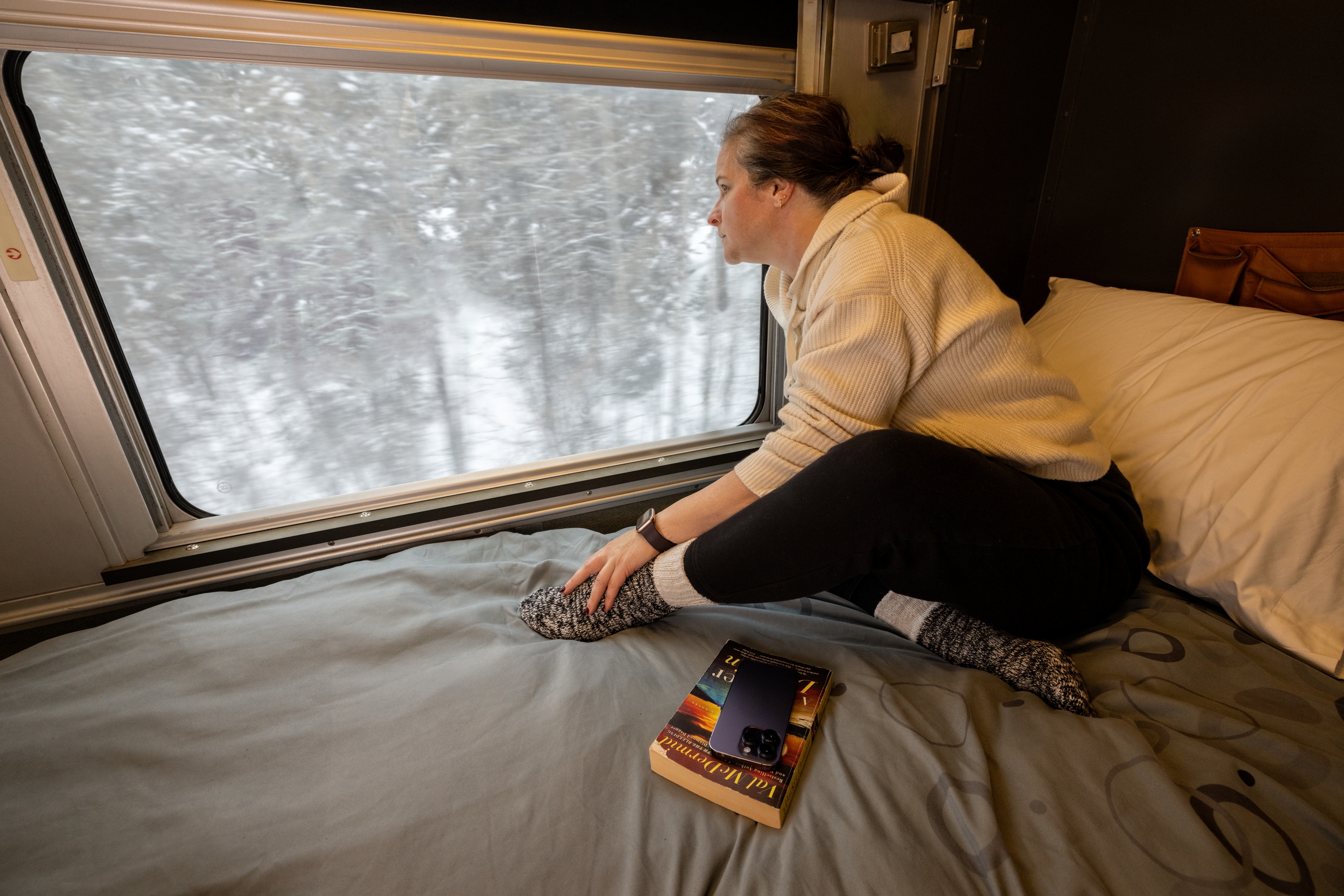 A passenger relaxes in a one bedroonm cabin on The Canadian Train 
