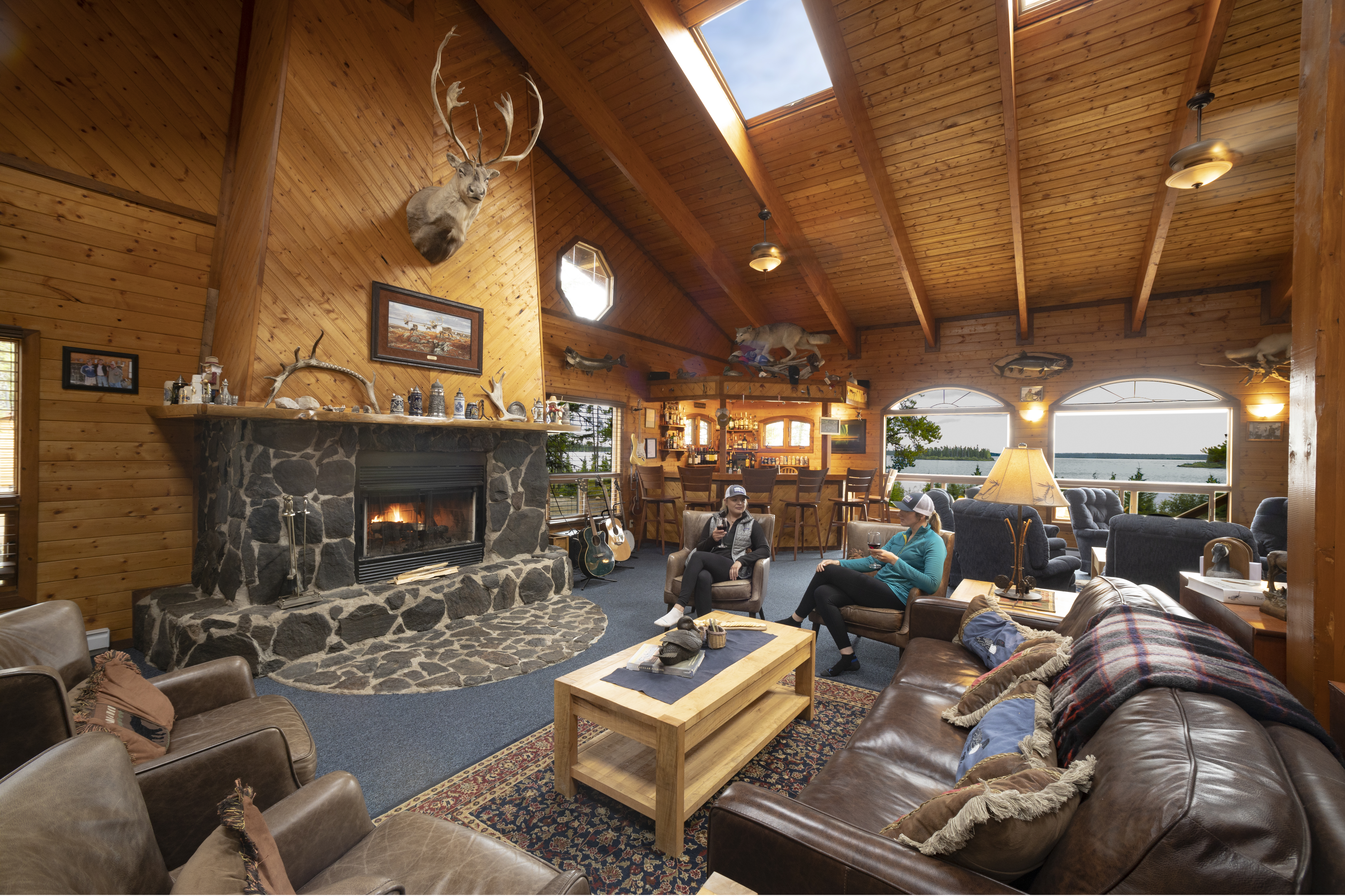 Main Lodge filled with furniture and a fireplace