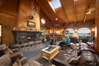 Main Lodge filled with furniture and a fireplace