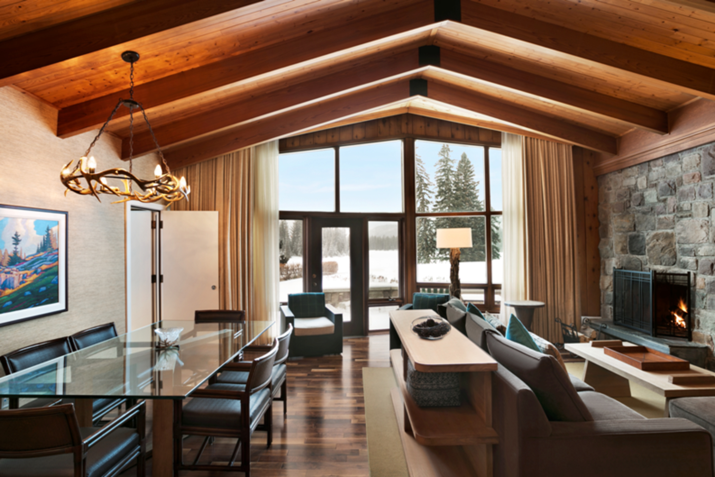 Elegant living space in with large ceilings and windows in Whistler Cabin, part of Fairmont Jasper Park Lodge