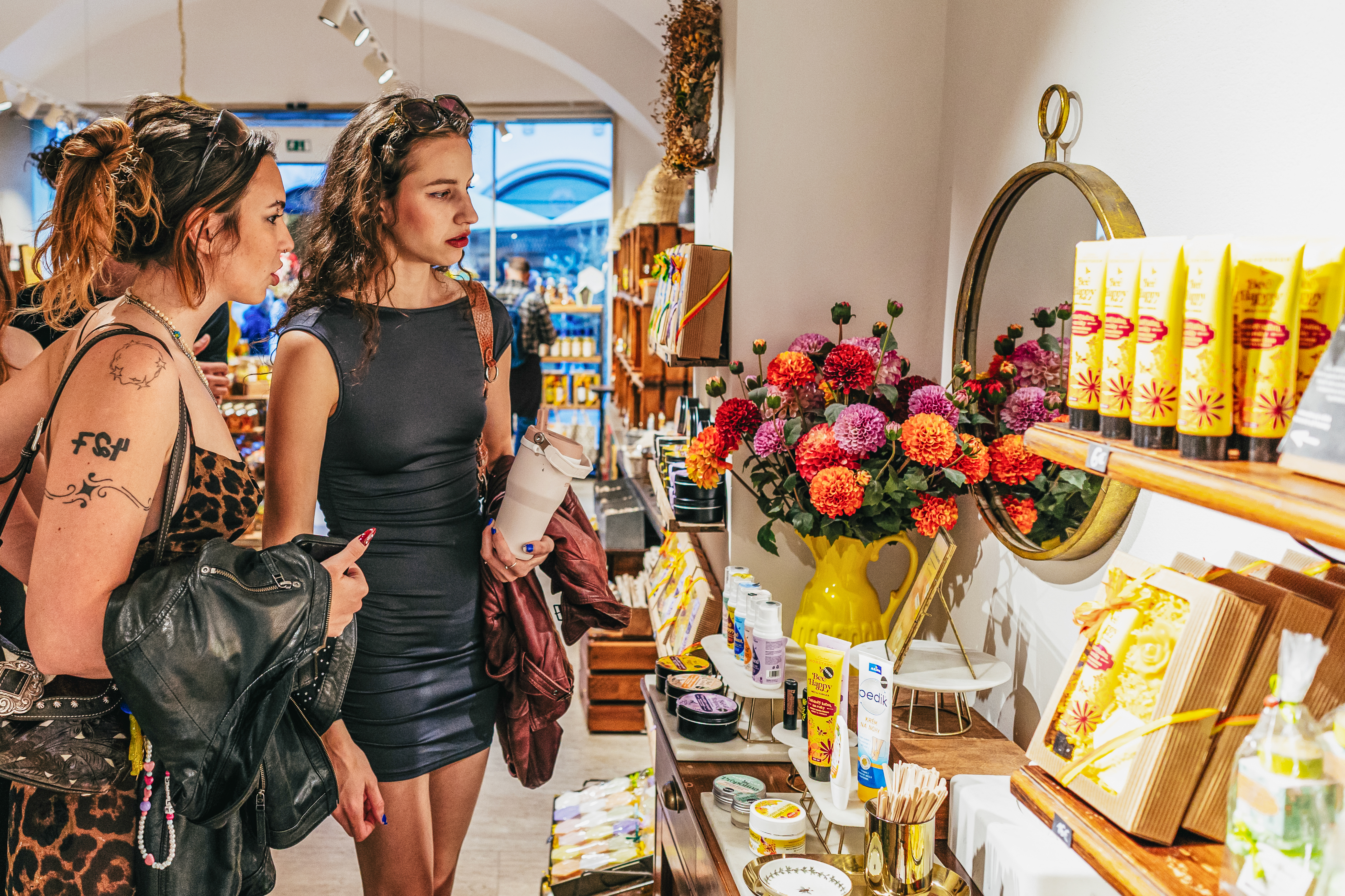 Shoppers browsing Slovak products and gifts in a local store.