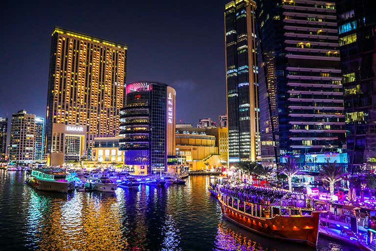 Sheikh Mohammed Bin Rashid Boulevard with views of Burj Khalifa and luxury shops.